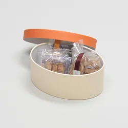 楕円型かぶせ蓋付焼き菓子詰め合わせボックス(フィナンシェ・エクレア他)柿色/クリーム-Mサイズ